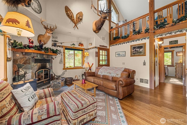 2290 Riffle Dr, Leavenworth, WA 98826 - living room featuring wood finished floors and a stone fireplace
