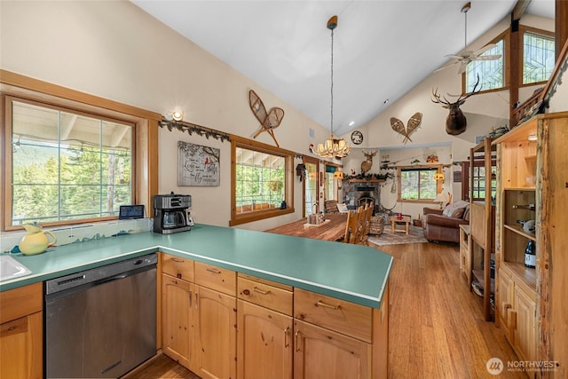 2290 Riffle Dr, Leavenworth, WA 98826 - kitchen featuring dishwasher, light wood-style flooring, a peninsula, high vaulted ceiling, and a chandelier