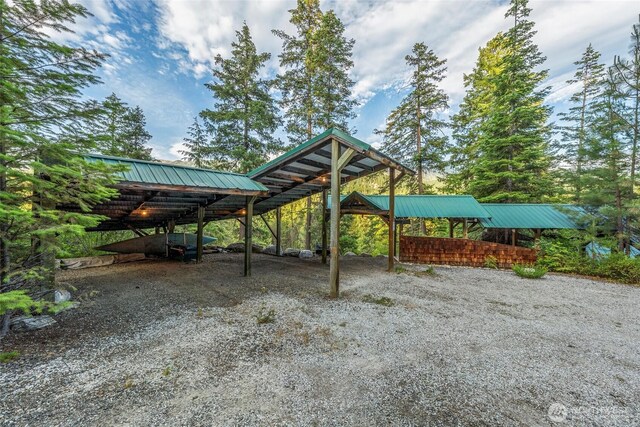 2290 Riffle Dr, Leavenworth, WA 98826 - view of yard featuring a detached carport and driveway