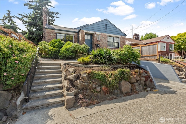 8315 24th Ave NW, Seattle, WA 98117 - view of front of house with stairway, brick siding, and a chimney