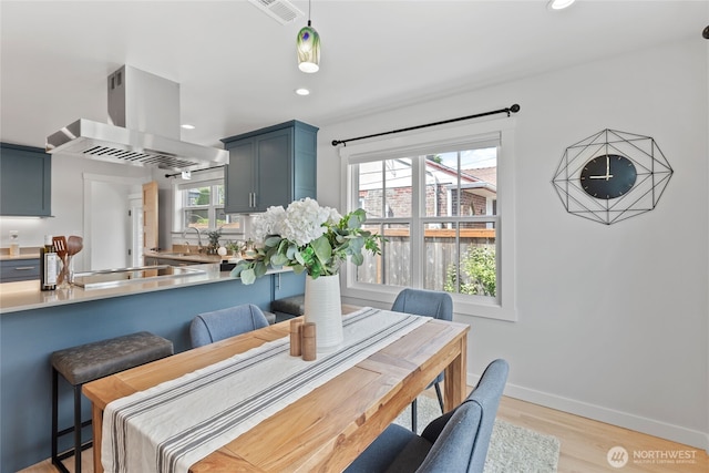 8315 24th Ave NW, Seattle, WA 98117 - dining space featuring light wood-style floors and recessed lighting