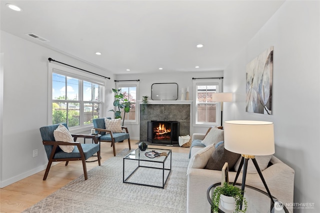 8315 24th Ave NW, Seattle, WA 98117 - living room with a premium fireplace, wood finished floors, and recessed lighting