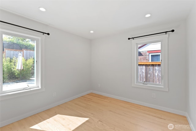 8315 24th Ave NW, Seattle, WA 98117 - unfurnished room with wood finished floors and recessed lighting