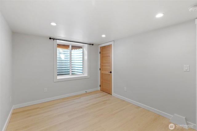 8315 24th Ave NW, Seattle, WA 98117 - empty room featuring wood finished floors, recessed lighting, and a smoke detector