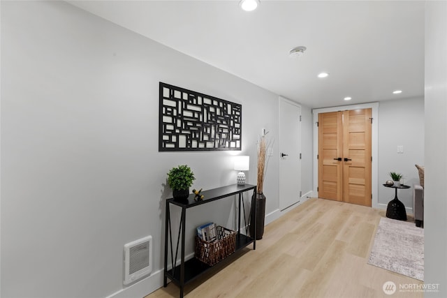 8315 24th Ave NW, Seattle, WA 98117 - foyer entrance with wood finished floors, recessed lighting, and heating unit