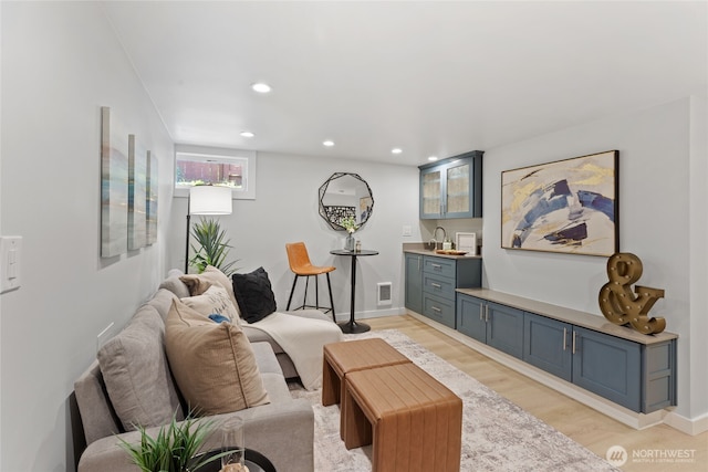 8315 24th Ave NW, Seattle, WA 98117 - living room featuring bar with sink, light wood finished floors, and recessed lighting