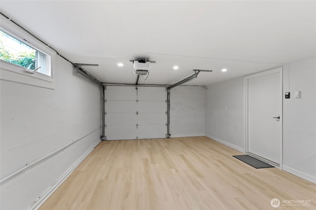 8315 24th Ave NW, Seattle, WA 98117 - garage featuring a garage door opener and recessed lighting