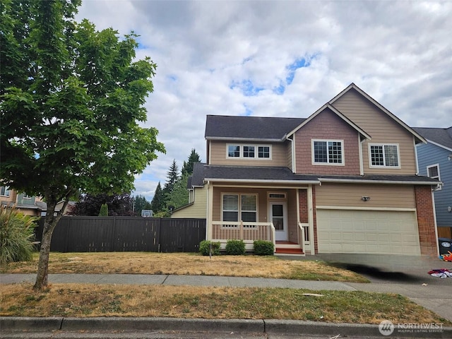 741 G St SW, Tumwater, WA 98512 - view of front of home with a porch, an attached garage, and concrete driveway