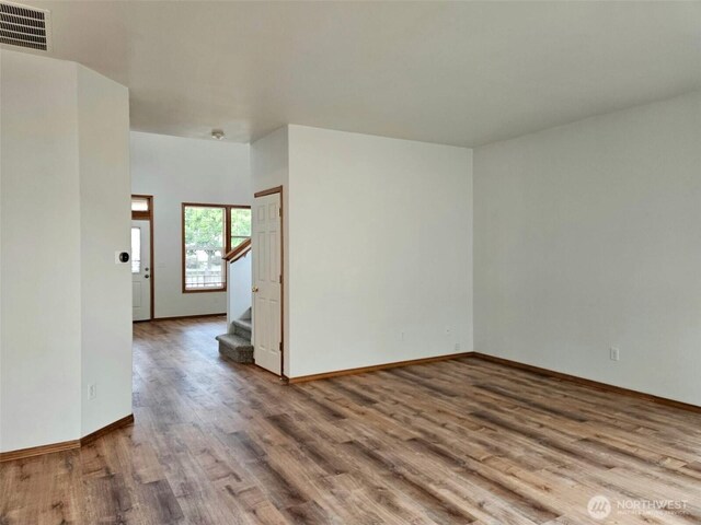 741 G St SW, Tumwater, WA 98512 - unfurnished room with wood finished floors and stairs