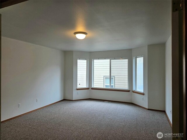 741 G St SW, Tumwater, WA 98512 - spare room with carpet flooring