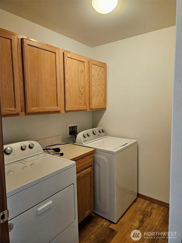 741 G St SW, Tumwater, WA 98512 - laundry area featuring cabinet space, dark wood-style floors, and separate washer and dryer