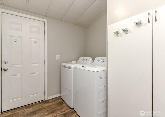 3010 248th Street Ct E, Spanaway, WA 98387 - washroom featuring washer and clothes dryer and wood finished floors