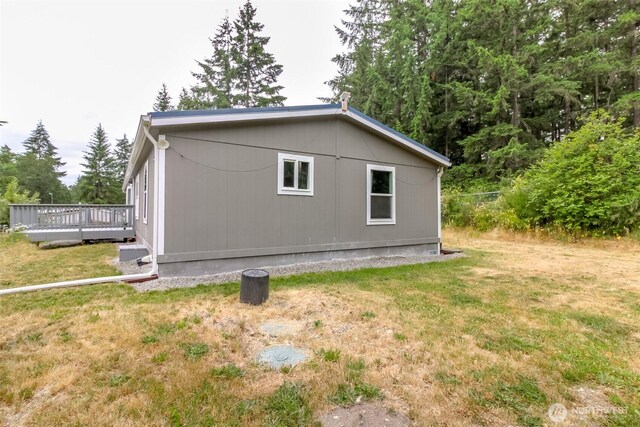 3010 248th Street Ct E, Spanaway, WA 98387 - view of side of home featuring a deck and a lawn