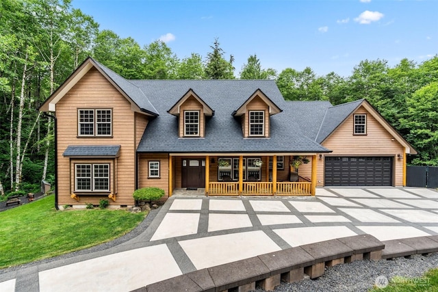 143 Scenic Ln, Mossyrock, WA 98564 - view of front facade with driveway, covered porch, a shingled roof, an attached garage, and a front lawn