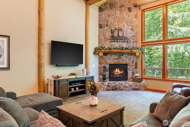 143 Scenic Ln, Mossyrock, WA 98564 - carpeted living room with a stone fireplace and healthy amount of natural light