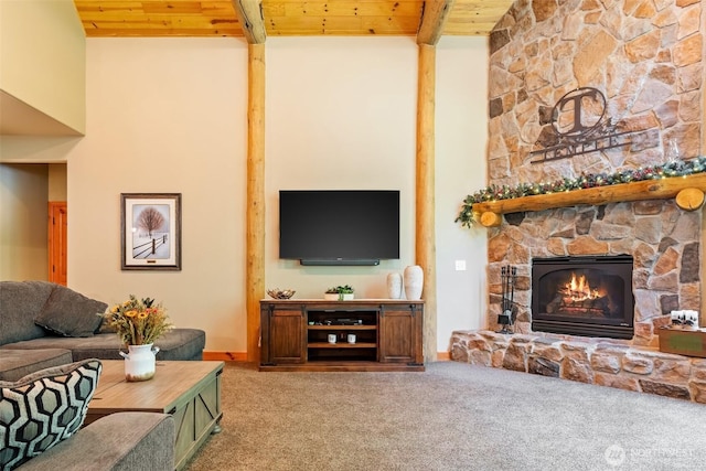 143 Scenic Ln, Mossyrock, WA 98564 - living room with a wood ceiling with exposed beams, carpet flooring, and a stone fireplace