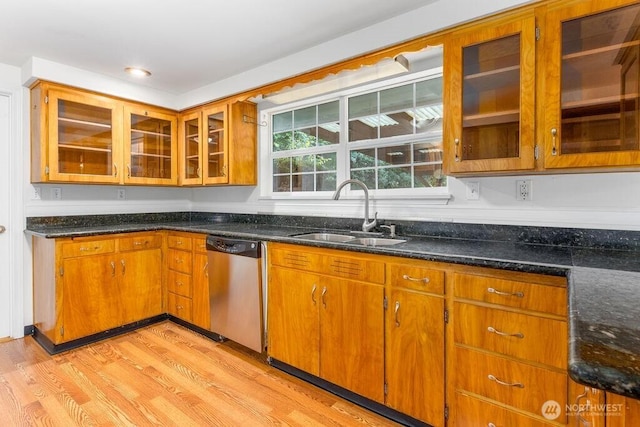 731 Maplewood Ave, Kent, WA 98030 - kitchen with dishwasher, light wood-style flooring, brown cabinets, and dark stone countertops