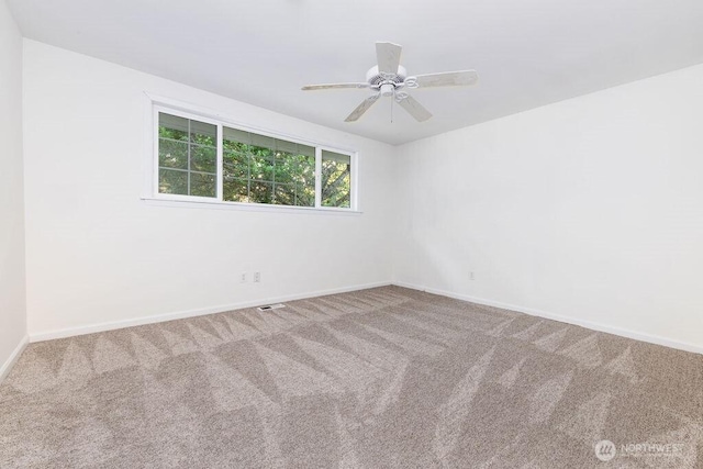731 Maplewood Ave, Kent, WA 98030 - carpeted empty room with baseboards and a ceiling fan