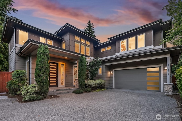 10637 128th Ave NE, Kirkland, WA 98033 - contemporary house featuring driveway and an attached garage