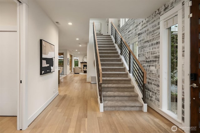 10637 128th Ave NE, Kirkland, WA 98033 - staircase with wood finished floors, recessed lighting, and a fireplace