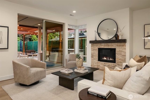 10637 128th Ave NE, Kirkland, WA 98033 - living room with a stone fireplace, wood finished floors, and recessed lighting
