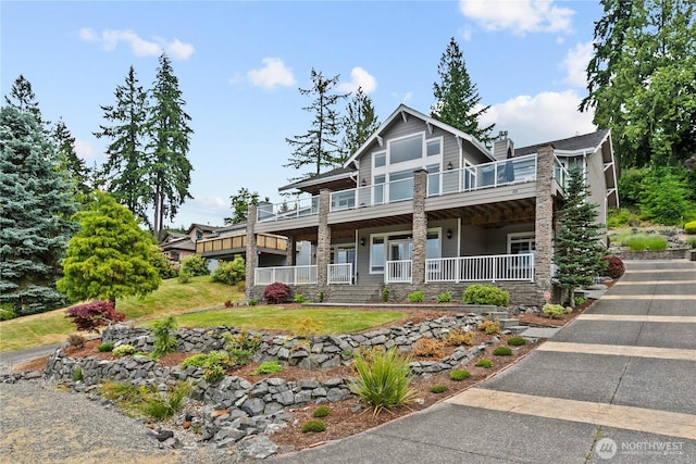 60 Marigold Dr, Bellingham, WA 98229 - view of front facade with a chimney, a balcony, and a porch