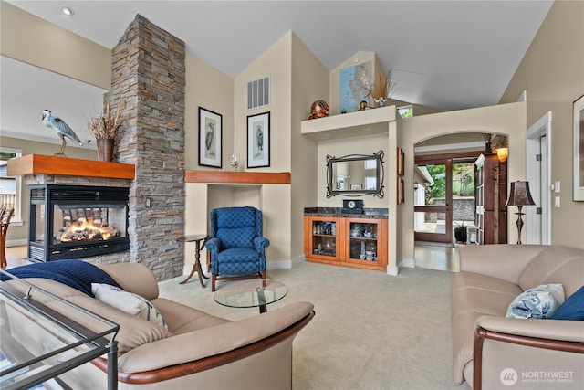 60 Marigold Dr, Bellingham, WA 98229 - living area with carpet flooring, lofted ceiling, a fireplace, and arched walkways