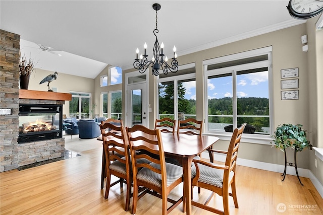 60 Marigold Dr, Bellingham, WA 98229 - dining area with a fireplace, light wood-style floors, crown molding, and a chandelier