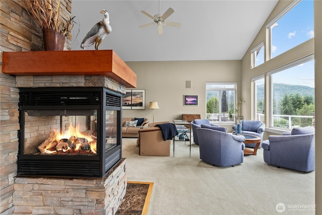 60 Marigold Dr, Bellingham, WA 98229 - living room with high vaulted ceiling, carpet floors, a fireplace, and a ceiling fan