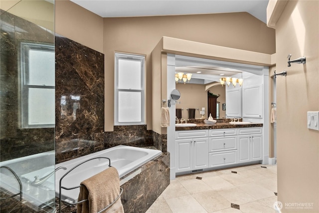 60 Marigold Dr, Bellingham, WA 98229 - full bathroom featuring double vanity, a garden tub, a chandelier, lofted ceiling, and tile patterned floors
