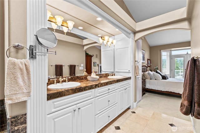 60 Marigold Dr, Bellingham, WA 98229 - ensuite bathroom featuring lofted ceiling, double vanity, recessed lighting, and tile patterned flooring