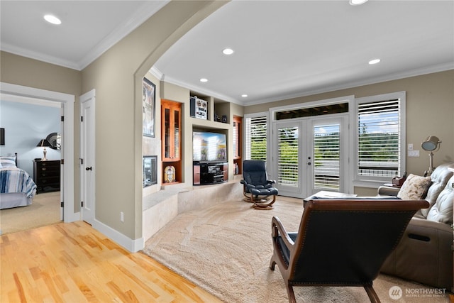 60 Marigold Dr, Bellingham, WA 98229 - living area with arched walkways, crown molding, recessed lighting, healthy amount of natural light, and wood finished floors