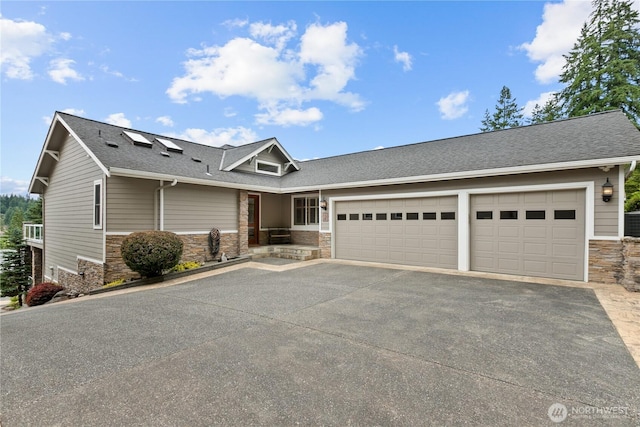 60 Marigold Dr, Bellingham, WA 98229 - view of front of house featuring stone siding, driveway, a garage, and a shingled roof