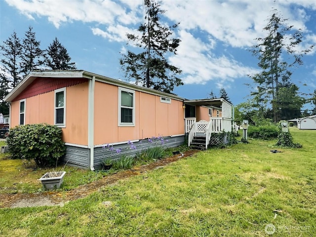 8304 192nd Street Ct E Unit 24, Spanaway, WA 98387 - back of property with a lawn