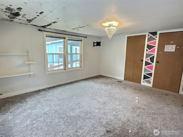 8304 192nd Street Ct E Unit 24, Spanaway, WA 98387 - carpeted empty room featuring a chandelier and baseboards