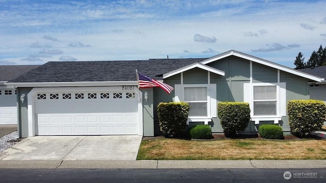 24027 222nd Pl SE Unit 88, Maple Valley, WA 98038 - ranch-style home with an attached garage, concrete driveway, roof with shingles, and a front yard