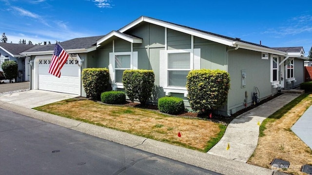 24027 222nd Pl SE Unit 88, Maple Valley, WA 98038 - view of front of home with an attached garage, concrete driveway, and a front yard