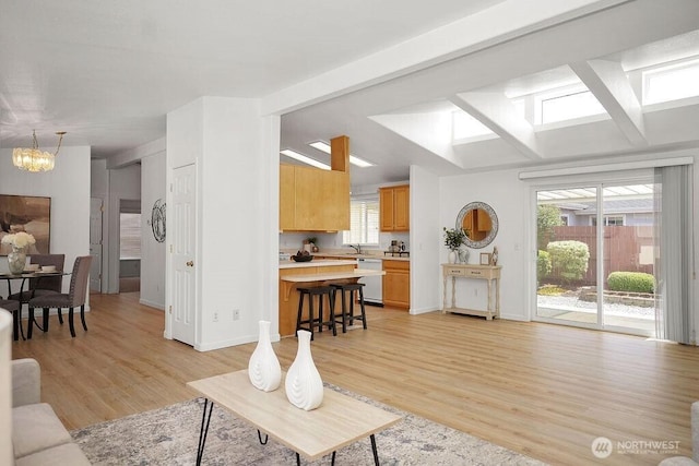 24027 222nd Pl SE Unit 88, Maple Valley, WA 98038 - living room with a chandelier and light wood-style floors