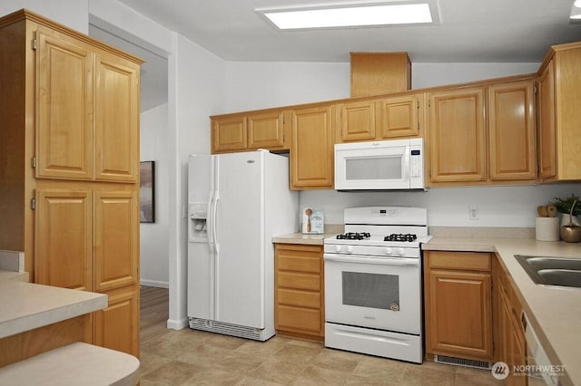 24027 222nd Pl SE Unit 88, Maple Valley, WA 98038 - kitchen featuring white appliances, lofted ceiling, and light countertops