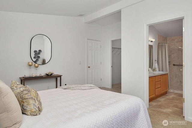 24027 222nd Pl SE Unit 88, Maple Valley, WA 98038 - bedroom with light carpet, a walk in closet, connected bathroom, and a closet