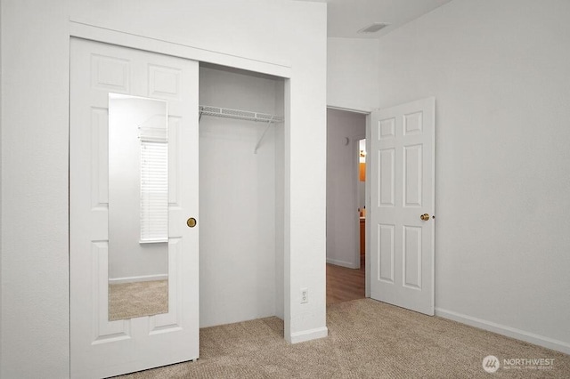 24027 222nd Pl SE Unit 88, Maple Valley, WA 98038 - unfurnished bedroom featuring carpet flooring and a closet