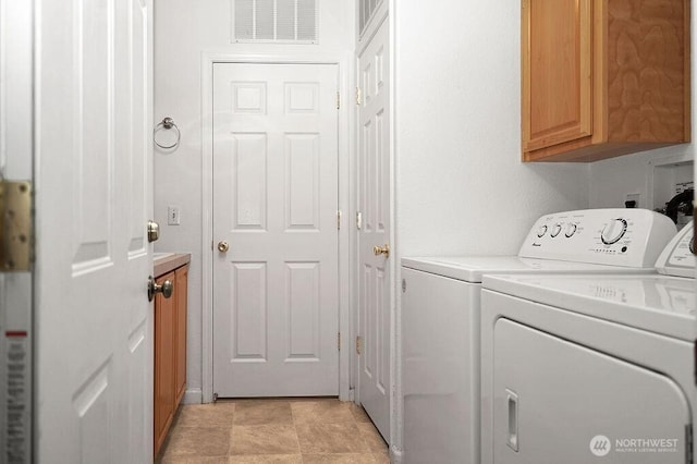 24027 222nd Pl SE Unit 88, Maple Valley, WA 98038 - laundry room with washing machine and dryer and cabinet space