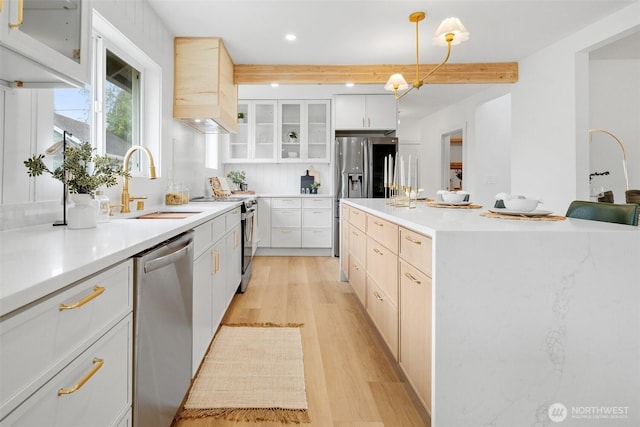 4658 N Defiance St, Tacoma, WA 98407 - kitchen with appliances with stainless steel finishes, light wood-type flooring, beamed ceiling, recessed lighting, and light countertops