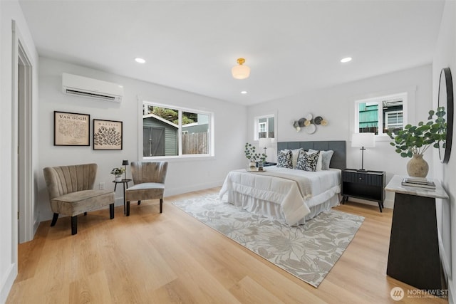 4658 N Defiance St, Tacoma, WA 98407 - bedroom featuring a wall mounted air conditioner, multiple windows, light wood-style floors, and recessed lighting