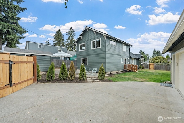 4658 N Defiance St, Tacoma, WA 98407 - rear view of house featuring a patio area and a fenced backyard
