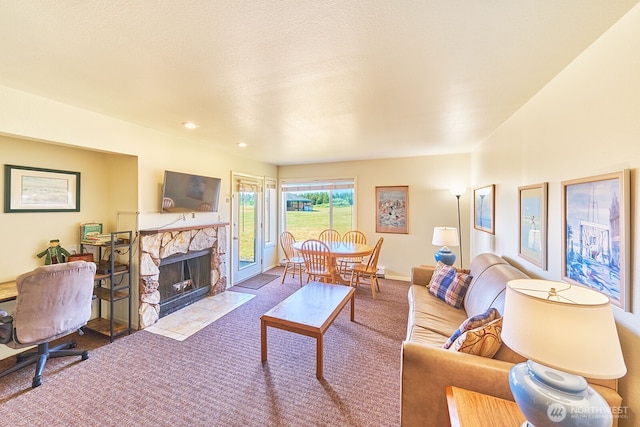 210 26th St NW Unit 201/2, Long Beach, WA 98631 - living area featuring carpet and a stone fireplace