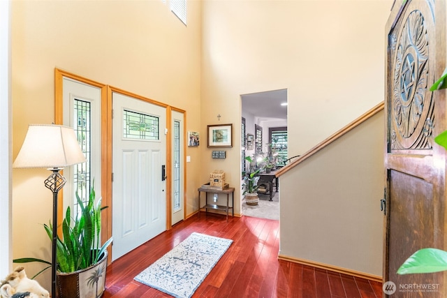 34059 Bridge View Dr NE, Kingston, WA 98346 - entrance foyer featuring healthy amount of natural light, a towering ceiling, wood finished floors, and stairway