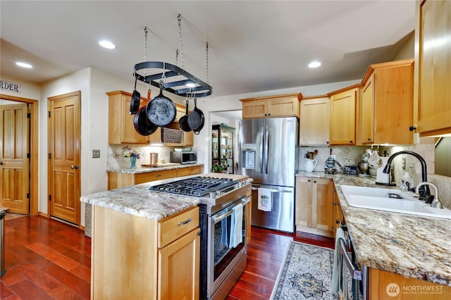 34059 Bridge View Dr NE, Kingston, WA 98346 - kitchen with appliances with stainless steel finishes, dark wood-style flooring, tasteful backsplash, light stone countertops, and recessed lighting