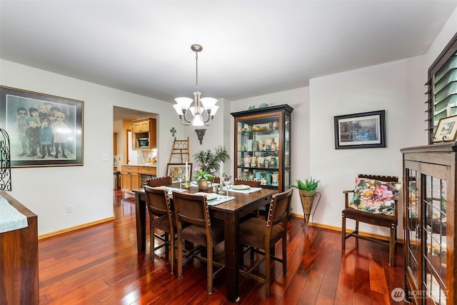 34059 Bridge View Dr NE, Kingston, WA 98346 - dining room with a chandelier and dark wood-style flooring