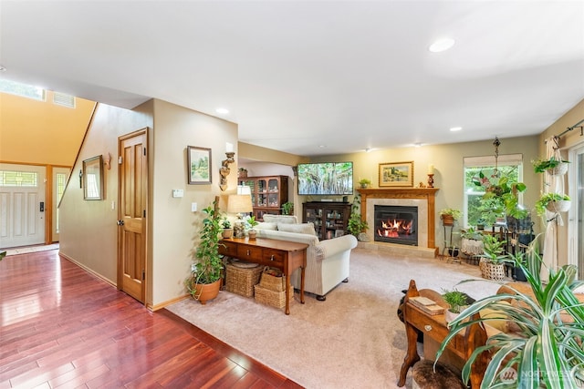 34059 Bridge View Dr NE, Kingston, WA 98346 - living room featuring a tiled fireplace, wood finished floors, and recessed lighting